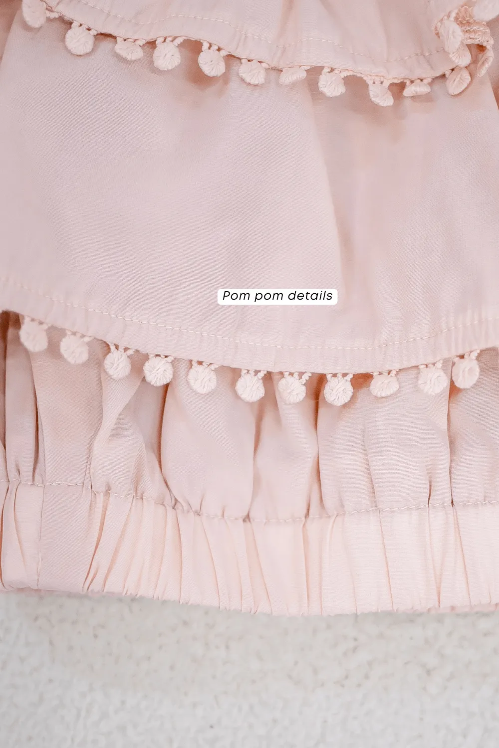 LINDSAY POM POM OFFSIE TOP IN PINK BEIGE