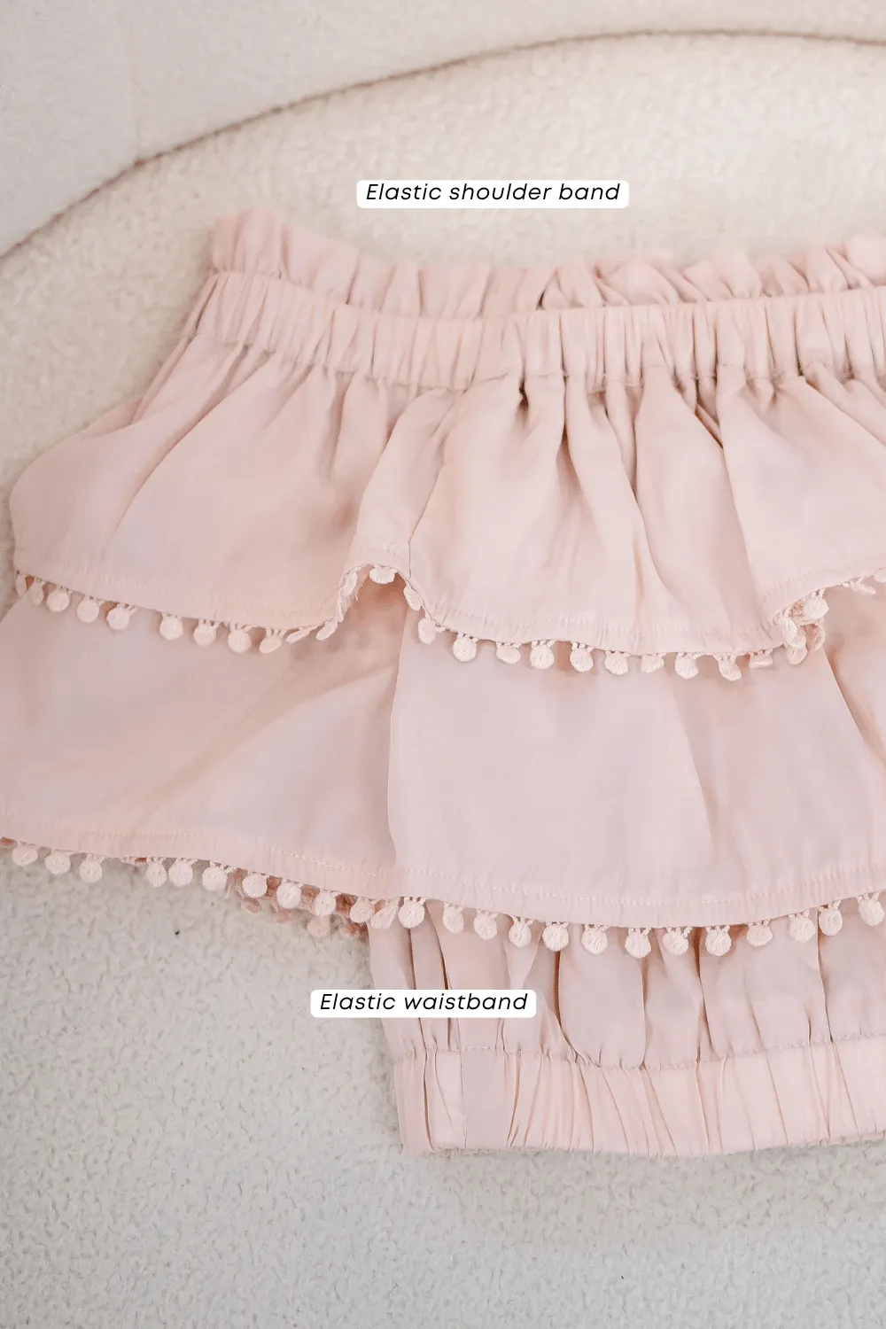 LINDSAY POM POM OFFSIE TOP IN PINK BEIGE