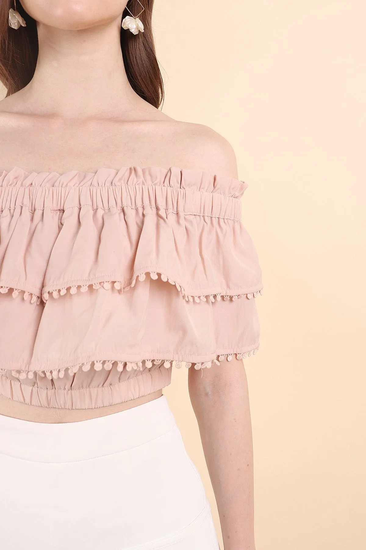 LINDSAY POM POM OFFSIE TOP IN PINK BEIGE