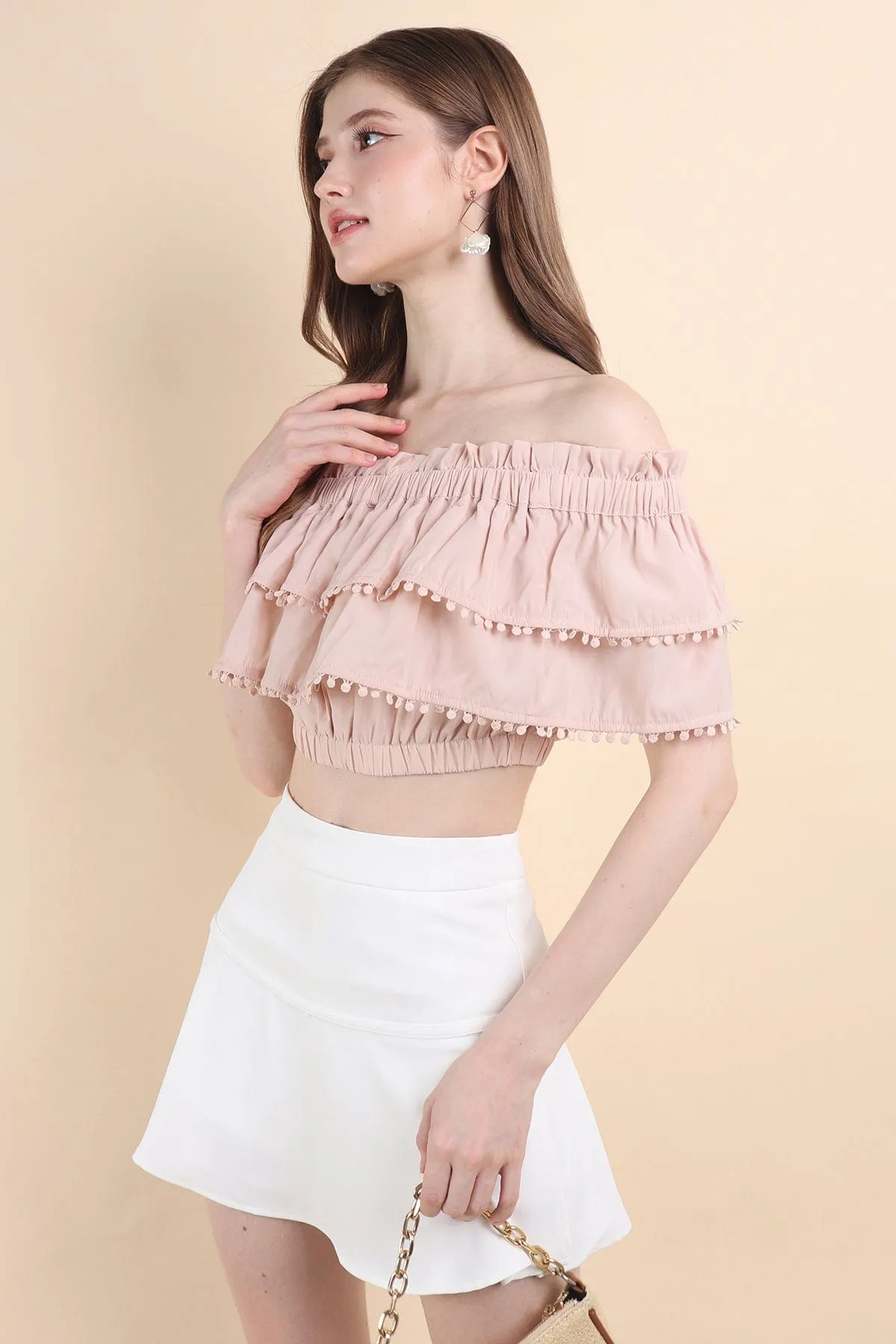 LINDSAY POM POM OFFSIE TOP IN PINK BEIGE
