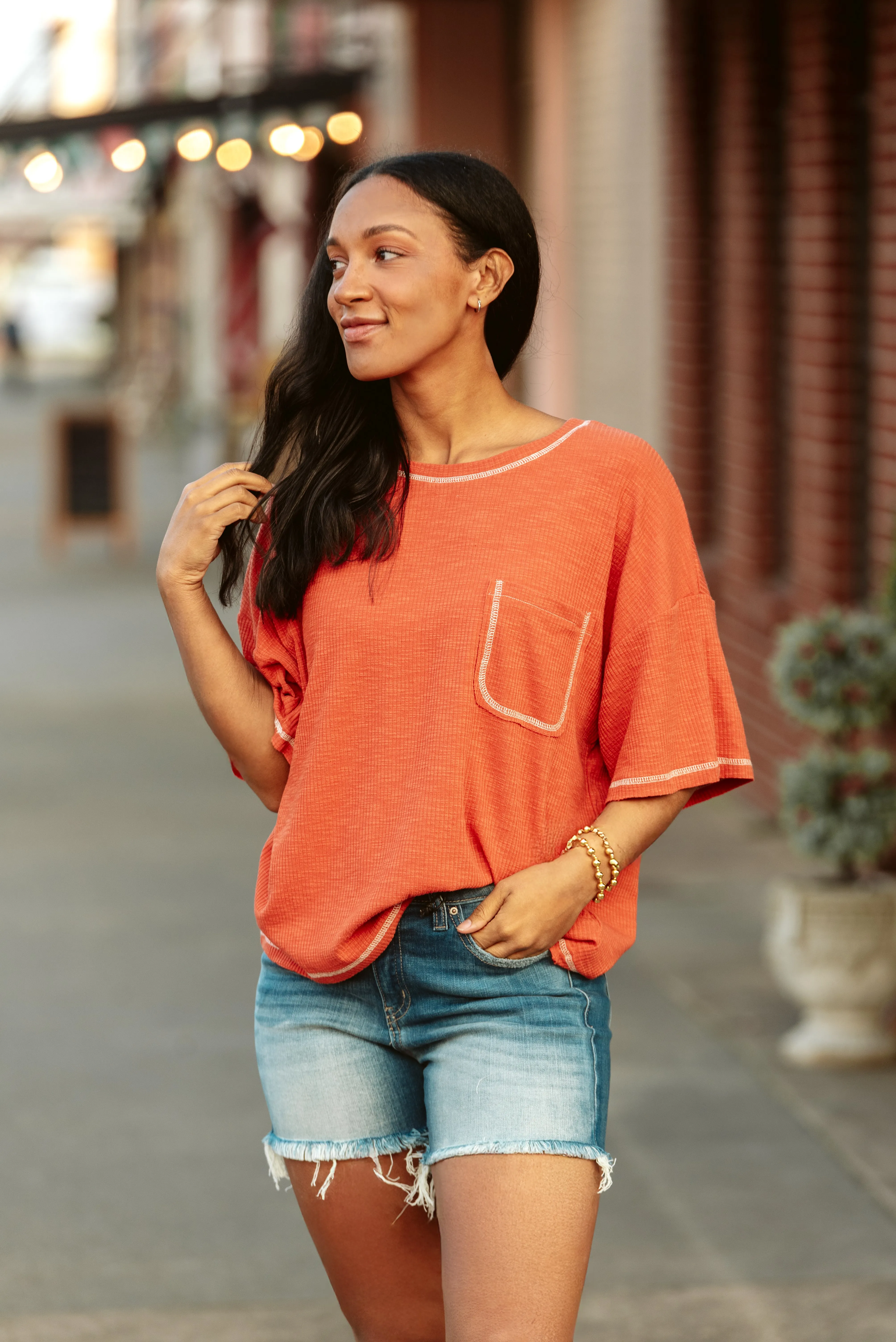 Mid Rise Medium Wash Raw Hem Shorts