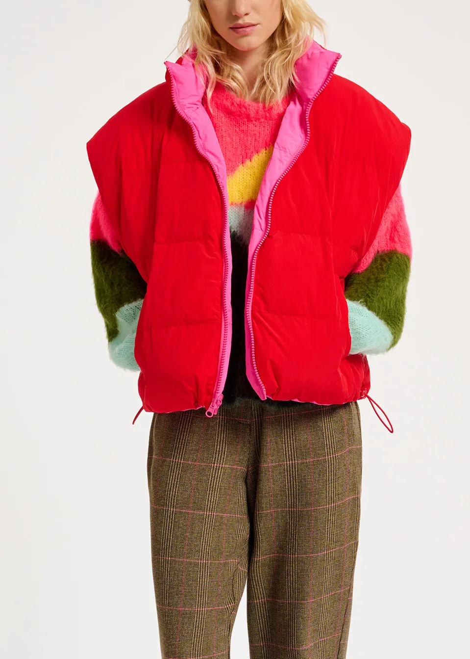 Neon pink and red reversible puffer vest